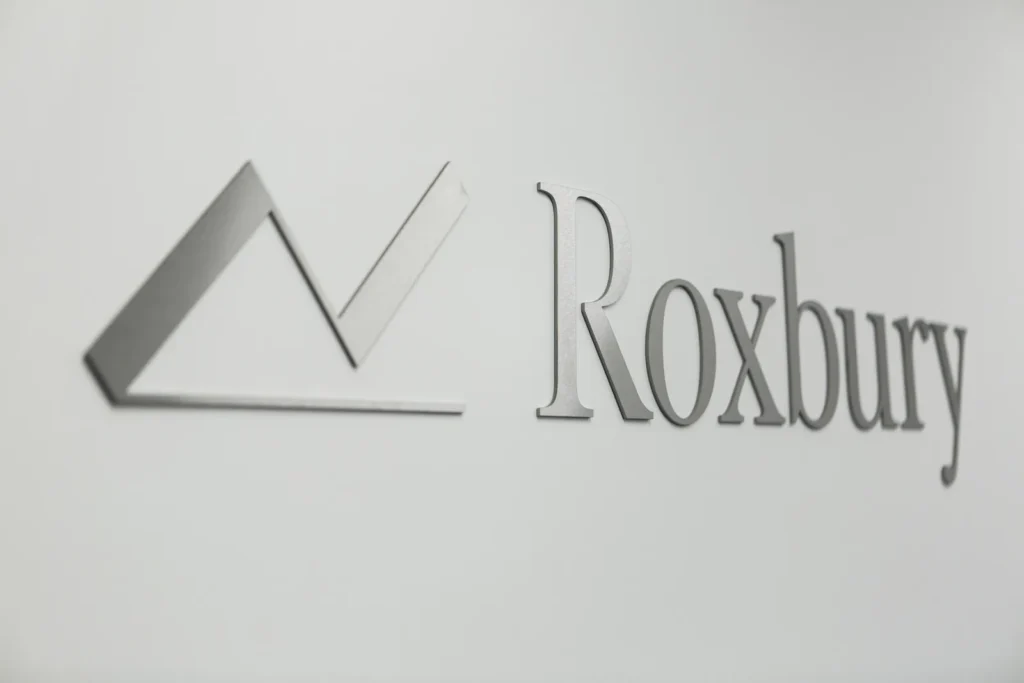 The Roxbury logo on the wall of the office